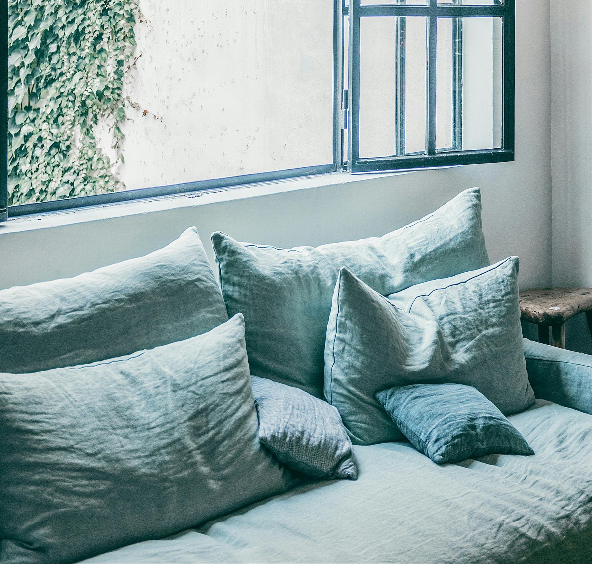 Lifestyle image of four seater sofa in modern Dubai villa – handcrafted premium seating by The Meem Store.