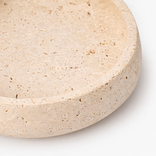 Close-up of a beige travetine bowl the meem store dubai