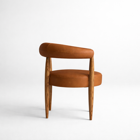 Modern curved leather dining armchair with tapered wooden legs luxury UAE furniture