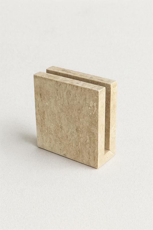 Angled view of travertine marble tissue holder showcasing natural beige stone texture – The Meem Store